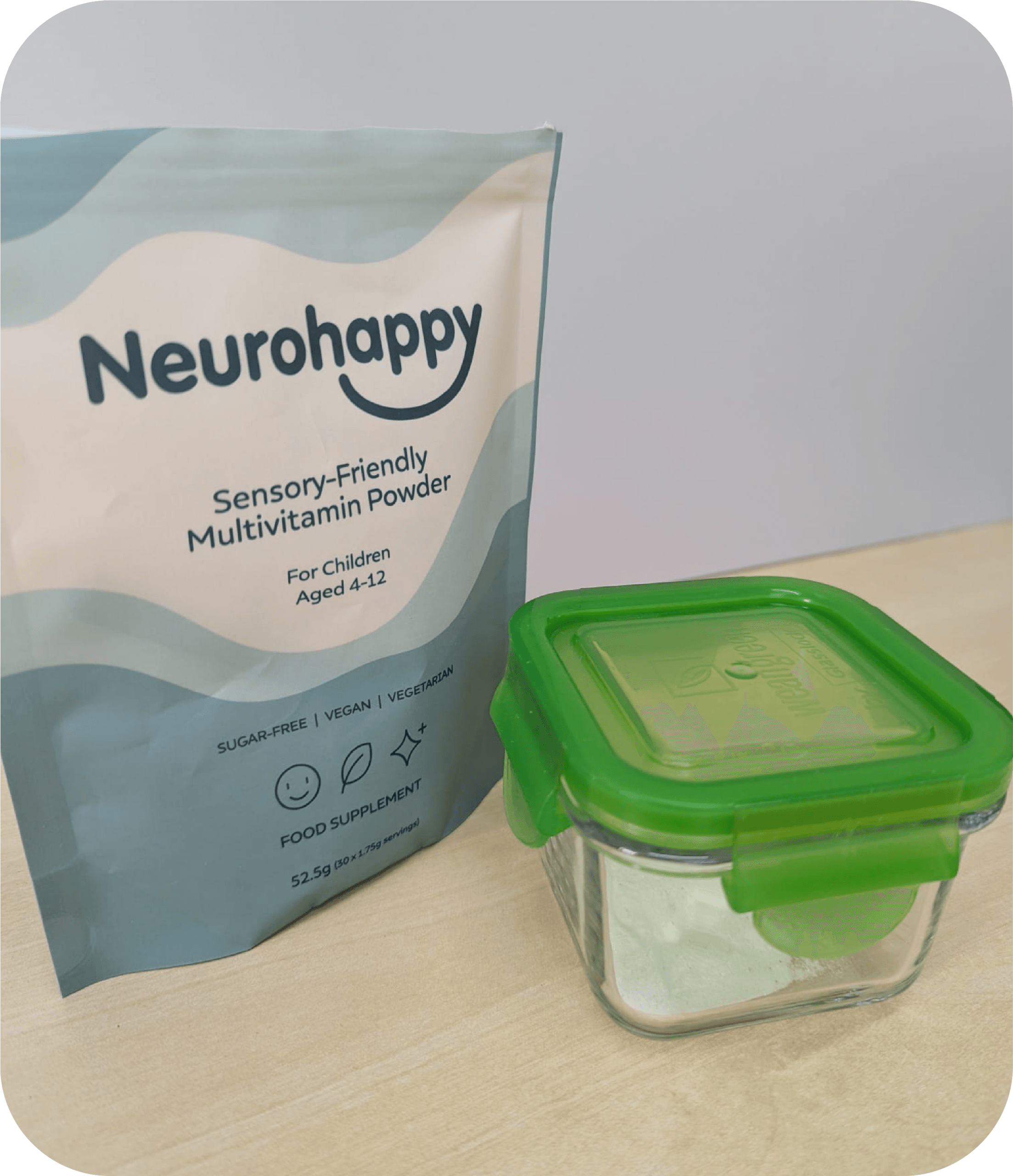 One Pouch of Neurohappy multi vitamin powder alongside a resealable storage tub